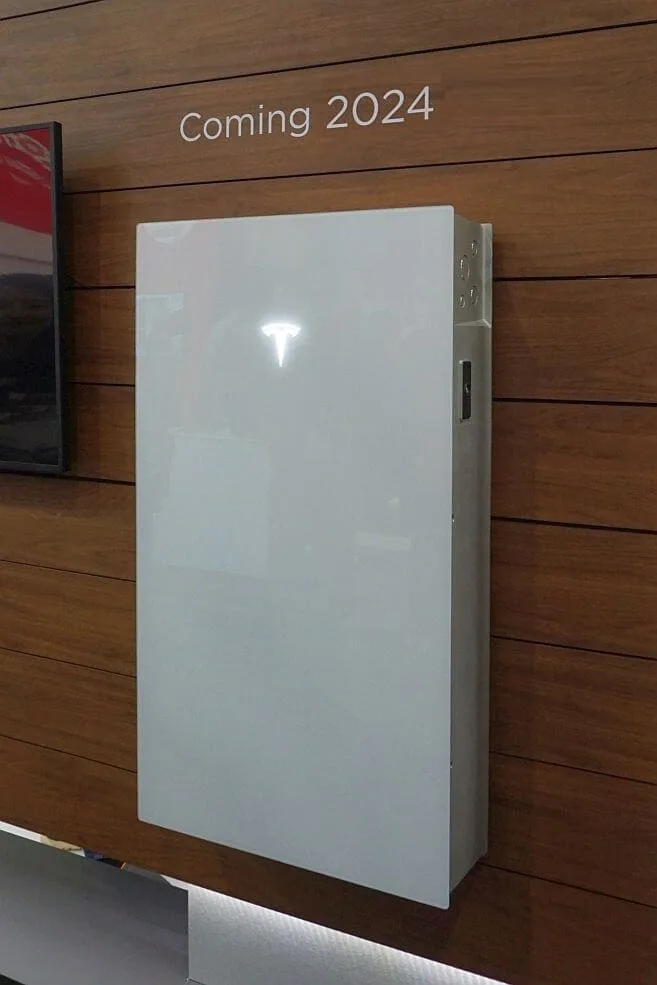 Tesla Powerwall 3 home battery with integrated inverter mounted on wall